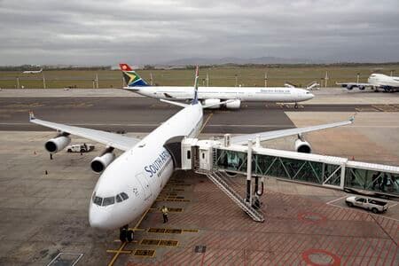 CAPE TOWN INTERNATIONAL AIRPORT SOUTH AFRICA Passengers loading a SAA A340-600
